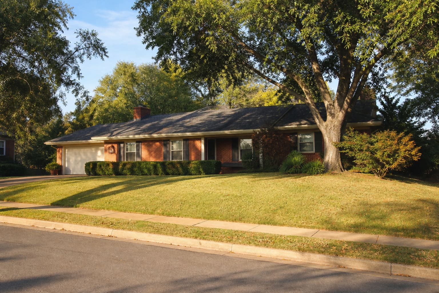 Brick home on a quiet tree-lined street in the Tulsa metro